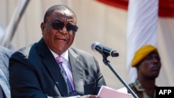 FILE: Zimbabwe's Vice-President Constantino Chiwenga speaks during the Defence Forces Day celebrations held at the National Sports Stadium in Harare on August 14, 2018. (Photo by Jekesai NJIKIZANA / AFP)