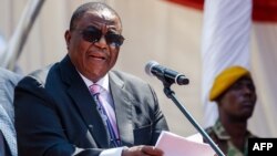 Zimbabwe's Vice-President Constantino Chiwenga speaks during the Defence Forces Day celebrations held at the National Sports Stadium in Harare on August 14, 2018. (Photo by Jekesai NJIKIZANA / AFP)