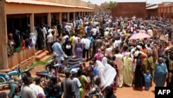 Malians stand in line to vote at a polling station set up in the Sabalibougoui school in Bamako during the presidential election in Mali on July 28, 2013.