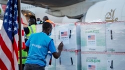 FILE - A UNICEF worker checks boxes of the Moderna coronavirus vaccine, donated by the U.S. government via the COVAX facility, after their arrival at the airport in Nairobi, Kenya, Aug. 23, 2021.