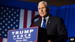 FILE - Republican Vice President-elect Mike Pence speaks during a campaign rally in Mason, Ohio.