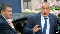 FILE - Bulgarian Prime Minister Boyko Borisov (R) arrives for an EU summit in Brussels, Belgium, June 29, 2016. Borisov announced his resignation Sunday after exit polls showed a pro-Russia candidate leading in the race for president.