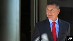 FILE - Former Trump national security adviser Michael Flynn leaves a federal courthouse in Washington, July 10, 2018, following a status hearing.