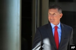 FILE - Former Trump national security adviser Michael Flynn leaves federal courthouse in Washington, July 10, 2018, following a status hearing.