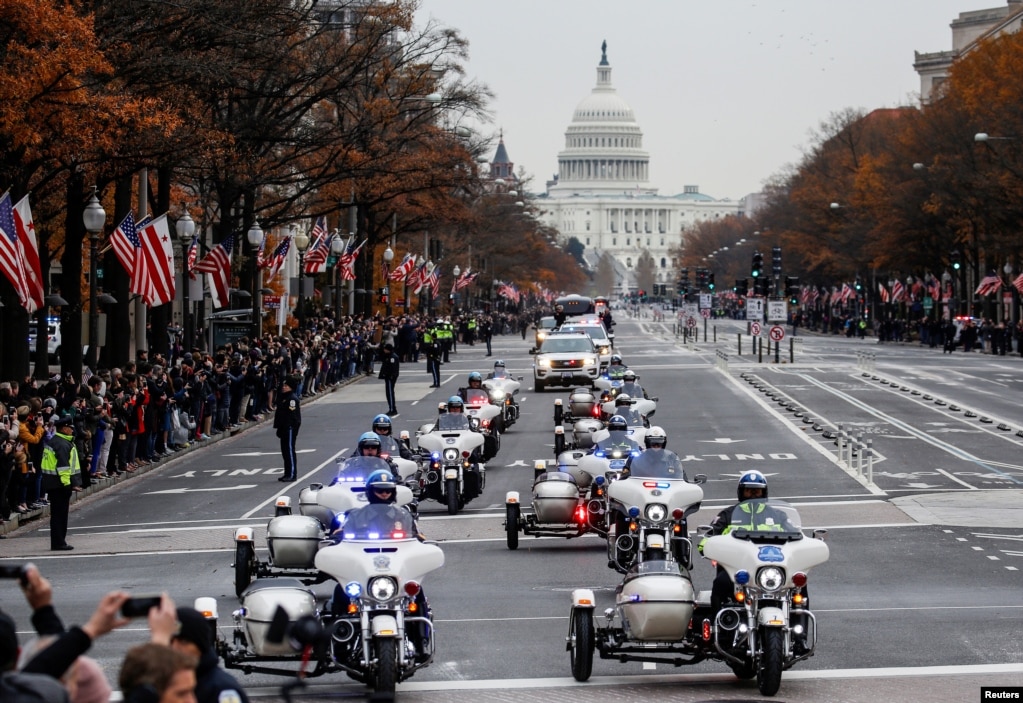The funeral procession carrying the body of former U.S. President George H. W. Bush passes down Pennsylvania Avenue in Washington, Dec. 5, 2018.