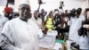 Senegal's incumbent President Macky Sall casts his vote during the presidential election at a polling station in Fatick, Senegal, Feb. 24, 2019. 