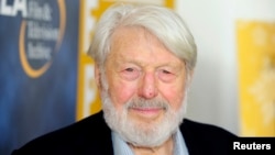 FILE - Actor Theodore Bikel arrives at the opening night of the UCLA Film and Television Archive film series "Champion: The Stanley Kramer Centennial" and the world premiere screening of the newly restored "Death of a Salesman" in Los Angeles, California, Aug. 9, 2013.