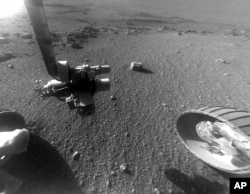This Jan. 4, 2018 photo made available by NASA shows a view from the front Hazard Avoidance Camera of the Opportunity rover on the inboard slope of the western rim of Endeavour Crater on the planet Mars.