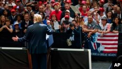 FILE - President Donald Trump speaks during a rally at the North Side Gymnasium in Elkhart, Indiana, May 10, 2018.