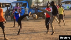 Youth displaced by fighting in South Sudan play soccer at Bidi Bidi refugee’s resettlement camp near the border with South Sudan, in Yumbe district, northern Uganda, Dec. 7, 2016.