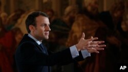 French President Emmanuel Macron speaks at the Elysee Palace in Paris, March 26, 2018.