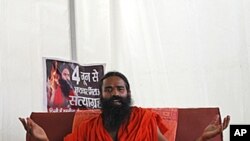 Yoga guru Baba Ramdev talks at the site of a Yoga camp he is likely to host later this week, in New Delhi, India, June 1, 2011.