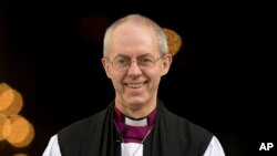 The new Archbishop of Canterbury, Justin Welby, walks outside St Paul's Cathedral as he poses for the media following his ceremony known as the confirmation of election in London, February 4, 2013.