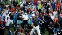 Rory McIlroy, of Northern Ireland, celebrates after winning the PGA Championship golf tournament at Valhalla Golf Club on Sunday, Aug. 10, 2014, in Louisville, Ky. (AP Photo/Jeff Roberson)