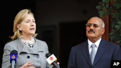 Yemeni President Ali Abdullah Saleh, right, listens to U.S. Secretary of State Hillary Rodham Clinton, as she speaks during a media conference in Sanaa, Yemen, 11 Jan. 2011