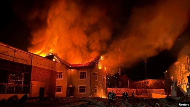 Firefighters work at a site where production facilities were damaged during a Russian drone strike, amid Russia's attack on Ukraine, near Bila Tserkva city, in Kyiv region, Ukraine, in this handout picture released Jan. 30, 2024.