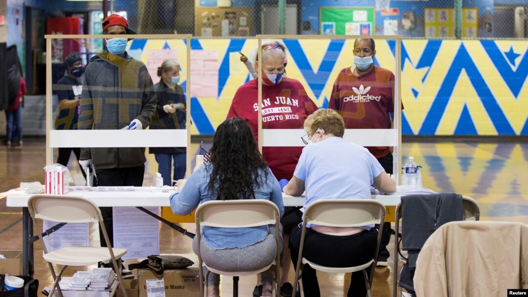 Voters prepare to cast their ballot in the Democratic primary in Philadelphia, Pennsylvania, U.S., June 2, 2020. 