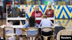 Voters prepare to cast their ballot in the Democratic primary in Philadelphia, Pennsylvania, U.S., June 2, 2020. 