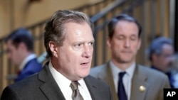 FILE - House Intelligence Chair Mike Turner, R-Ohio, left, speaks with reporters on Capitol Hill in Washington, Feb. 15, 2024.