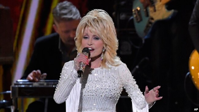 FILE - This Nov. 13, 2019 file photo shows Dolly Parton performing at the 53rd annual CMA Awards in Nashville, Tenn.