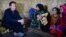 British Prime Minister David Cameron meets Syrian refugee families at a tented settlement camp in the Bekaa Valley on the Syrian - Lebanese border, Sept. 14, 2015. 