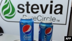 FILE - Cans with soft drinks partially sweetened with stevia, produced by PureCircle, are seen in an Oct. 31, 2014, illustration photo.