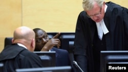 William Ruto (C) sits in the courtroom of the International Criminal Court in The Hague, May 14, 2013.