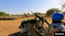 FILE - A United Nations peacekeeper on patrol in Sudan's Darfur region.