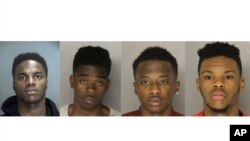 From left to right, Daniel Russell, Christen Glenn, King Edwards, and Hosea Moore are accused of killing 31-year-old Somali taxi driver Ramadhan Mohamed during a robbery in Pittsburgh.