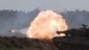 Kifaru aina ya Leopard 2 kikitekeleza mashambulizi wakati wa zoezi la wanajeshi wa NATO, Bemowo, Piskie, karibu na Poland. May 24, 2022
