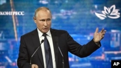 FILE - Russian President Vladimir Putin speaks at the Eastern Economic Forum in Vladivostok, Russia, Sept. 5, 2019. 