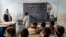 FILE - Afghan school boys attend their classroom on the first day of the new school year, in Kabul, March 25, 2023. The Taliban's "abusive" educational policies are harming boys as well as girls in Afghanistan, according to a Human Rights Watch report published Wednesday.
