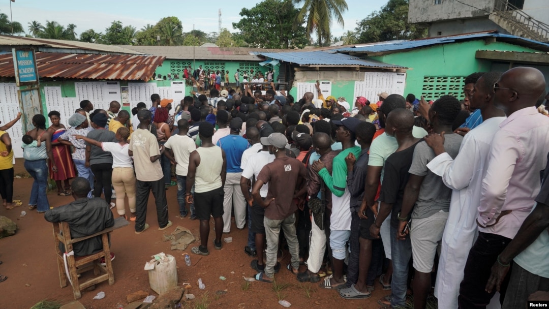 People wait to cast their votes during Liberia's presidential election in Monrovia, Liberia, on Oct. 10, 2023.
