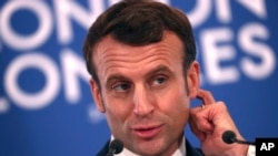 French President Emmanuel Macron speaks during a media conference at the conclusion of a NATO leaders meeting, Dec. 4, 2019. Macron's push for a digital services tax on U.S. companies has led to a U.S. import tax on French products.