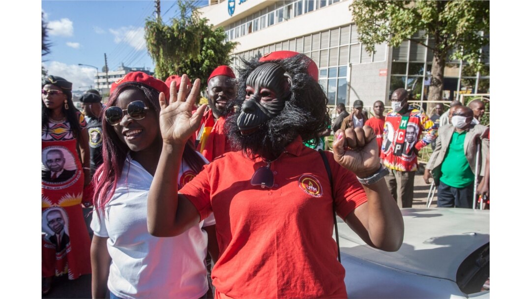 A United Transformation Movement supporter wears a unique mask as a preventive measure against the spread of the COVID-19 at Mount Soche hotel in Blantyre, May 6, 2020, Malawi.
