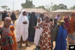 FILE—Parents wait for news about the kidnapped LEA Primary and Secondary School Kuriga students in Kuriga, Kaduna, Nigeria, March 9, 2024