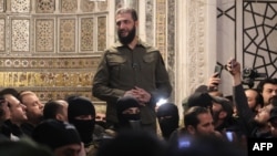 FILE - Islamist group Hayat Tahrir al-Sham (HTS) leader Abu Mohammed al-Jolani addresses a crowd at the capital's landmark Umayyad Mosque on Dec. 8, 2024.