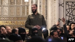 Islamist group Hayat Tahrir al-Sham (HTS) leader Ahmad al-Sharaa, also known as Abu Mohammed al-Jolani, addresses a crowd at the capital's landmark Umayyad Mosque on Dec. 8, 2024.