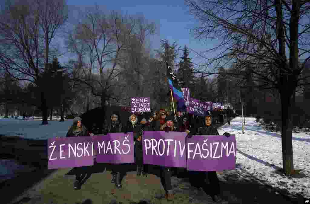 Activists hold a banner that reads &quot;Women&#39;s March against Fascism&quot; during the Women&#39;s March rally in Belgrade, Serbia, Saturday, Jan. 21, 2017. The march was held in solidarity with the Women&#39;s March on Washington, advocating women&#39;s rights and opposing Donald Trump&#39;s presidency. (AP Photo/Darko Vojinovic)