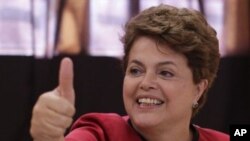 Dilma Rousseff, presidential candidate for the Workers Party, gestures after voting during Brazil's presidential election runoff in Porto Alegre, Brazil, 31Oct10