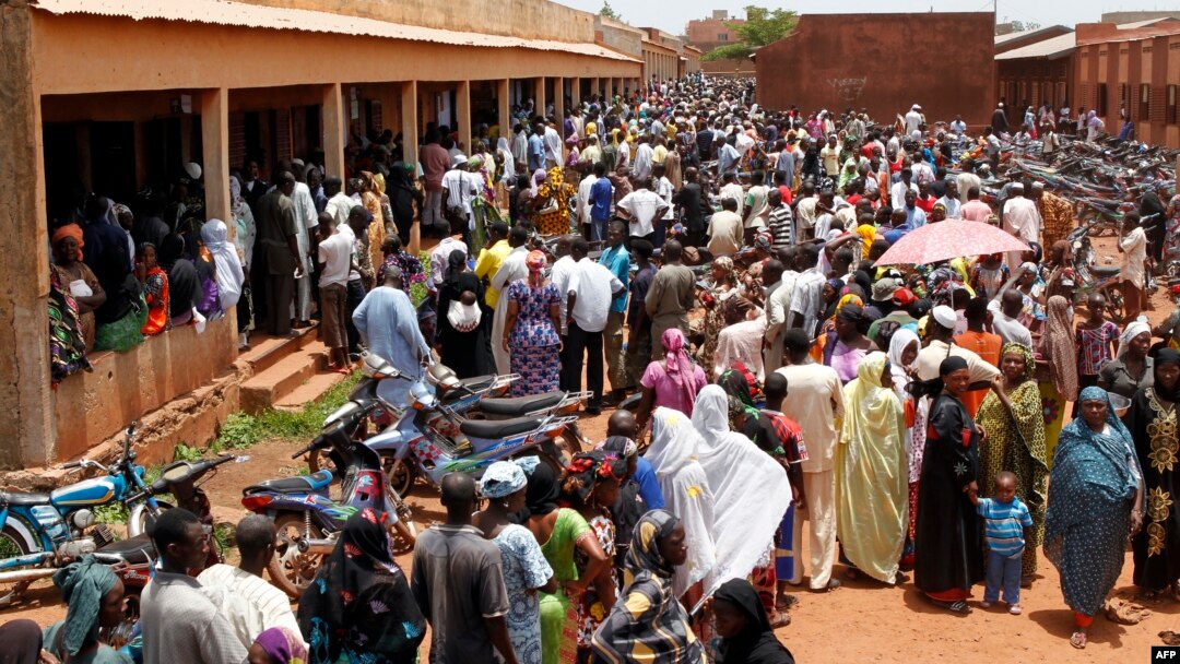Malians stand in line to vote at a polling station set up in the Sabalibougoui school in Bamako during the presidential election in Mali on July 28, 2013.