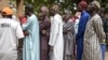 Voters wait in line outside a voting station in the fishing village of Ndayane on Nov. 17, 2024, during Senegal's parliamentary elections, with the country's new leaders aiming for a clear majority to see through their ambitious reform agenda.