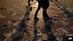 People walk on leaflets regarding the upcoming referendum in Istanbul, April 15, 2017. Turkey votes on a referendum Sunday on constitutional reforms to expand Turkey's President Recep Tayyip Erdogan's powers.