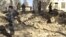Afghan forces inspect at the site of suicide attack in Spin Boldak district of Kandahar province January 6, 2013. 