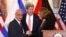 Chief Palestinian negotiator Saeb Erekat (L-R), U.S. Secretary of State John Kerry and Israel's Justice Minister Tzipi Livni shake hands at the end of talks in Washington, July 30, 2013. 
