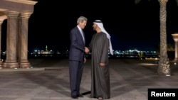 U.S. Secretary of State John Kerry (L) speaks to Abu Dhabi's Crown Prince Sheikh Mohammed bin Zayed al-Nahyan before their meeting at the Emirates Palace in Abu Dhabi, March 4, 2013.