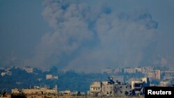 Smoke rises after an Israeli airstrike in Gaza, after a temporary truce between Israel and the Palestinian Islamist group Hamas expired, as seen from southern Israel