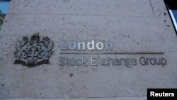 FILE - Signage is seen outside the entrance of the London Stock Exchange in London, Britain. Aug 23, 2018.