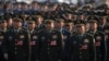 Military delegates march to the Great Hall of the People to attend a plenary session of China's National People's Congress, in Beijing, March 8, 2025.