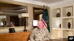 Marine Gen. Frank McKenzie, top U.S. commander for the Middle East, speaks to reporters traveling with him in Riyadh, Saudi Arabia, on May 23, 2021. 